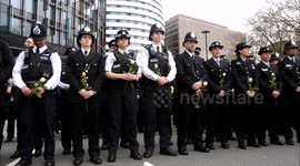 Police officers and civilians pay tribute to victims of Westminster terror attack