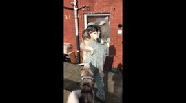 Man hugs dogs while dressed as a dog