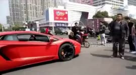 Lamborghini crashes into scooter in China