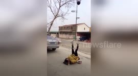 Teenage acrobat performs amazing basketball trick