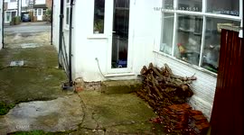 Hermes throwing parcel over fence