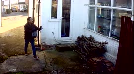 Hermes throwing parcel over fence