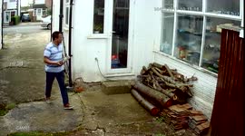 Hermes throwing parcel over fence