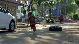 Unique Muay Thai training regimen - pulling a tire!