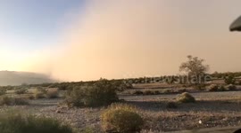 Timelapse of a wall of dust rolling into Desert Center, CA