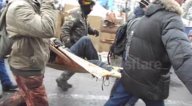 Injured Protesters Carried from Kiev Square