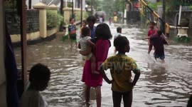 Flash flood is a kid's playground in Jakarta, the capital of Indonesia