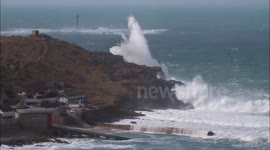 Waves cover cliff at Sennen