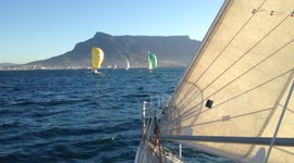 Lovely summer sailing yachts on blue water and Table Mountain as a backdrop.