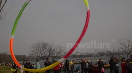 Flying a colourful ring kite