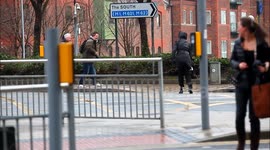 The moment pedestrians are blown off their feet in Leeds.