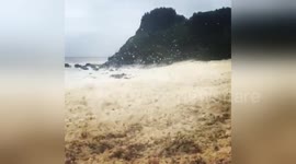 Mass of sea foam washes onto Australia beach after Cyclone Debbie