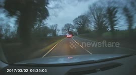 Car overtaking on blind bend. MGIF