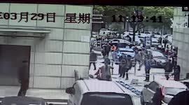 Martial arts coach catches worker falling down from eight-metre-high wall
