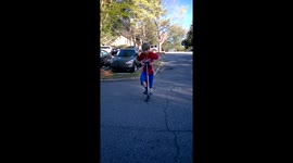 Youngster uses skipping rope while bouncing on a pogo stick