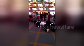 Chinese mall staff allegedly made to crawl along road for missing sales target