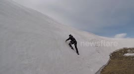 Man attempts to scale sheer glacier wall