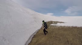 Newsflare Edit - Man attempts to scale sheer glacier wall