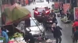 Out-of-control car crashes into market stall