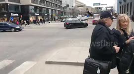 Police speed to the scene after lorry rams crowds in Stockholm, Sweden