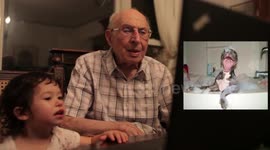 Baby and Grandfather look at pictures of cute animals :)