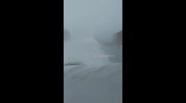 Car Burried in Driveway During Blizzard