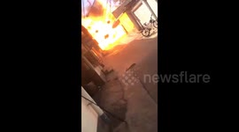 Flaming car ignites gas cylinders causing huge explosion