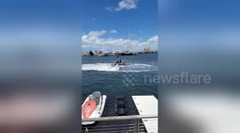 Newsflare Edit - Girl face plants into the sea during flyboard fail
