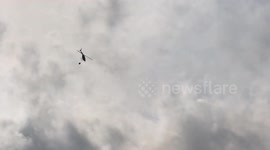 Helicopter Dropping Water on Wildfire
