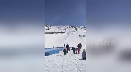 Skier absolutely nails 'water slide' trick