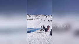 Skier absolutely nails 'water slide' trick