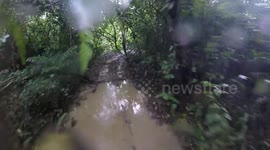 Man flips quad bike on muddy track