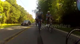Car Almost Hits Pack of Cyclists