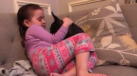 Little girl loves her cute puppy