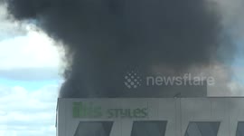 Firefighters struggle to enter building to fight fire