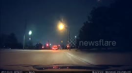 Snowplow ploughs through red light