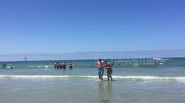 EPIC FAIL - Wife jumps on husband at the beach and falls on head, husband laughs hard - HIGH FRAME RATE