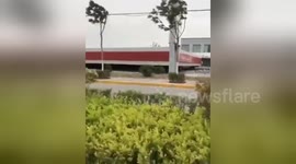 Petrol station collapses in strong wind