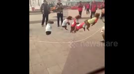 Just five poodles using a skipping rope