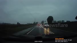 UK Bad Drivers : Audi driver pulls out in front of HGV in the pouring rain