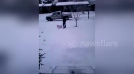 Dad uses laundry basket for daughter's first snow!