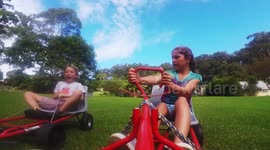 Boy crashes his billycart into his sister