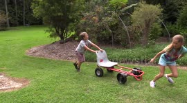 Dad builds billycarts with his children using furniture removal trolleys
