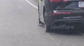 Audi blows two tires and keeps going!