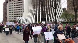 People march at the Rochester, NY