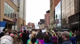 Protestors chant at the Rochester, NY