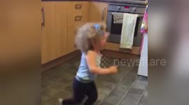 Toddler's funk dance to Bruno Mars sends her flying out of the kitchen