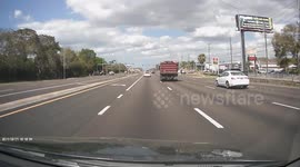 dump truck crashes into 2 cars