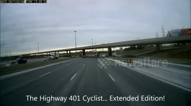 Cyclist crosses Highway 401 in Toronto!
