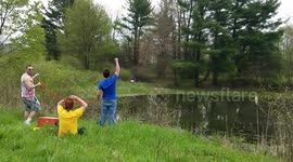 The proper way to pass a beer across a lake to a friend